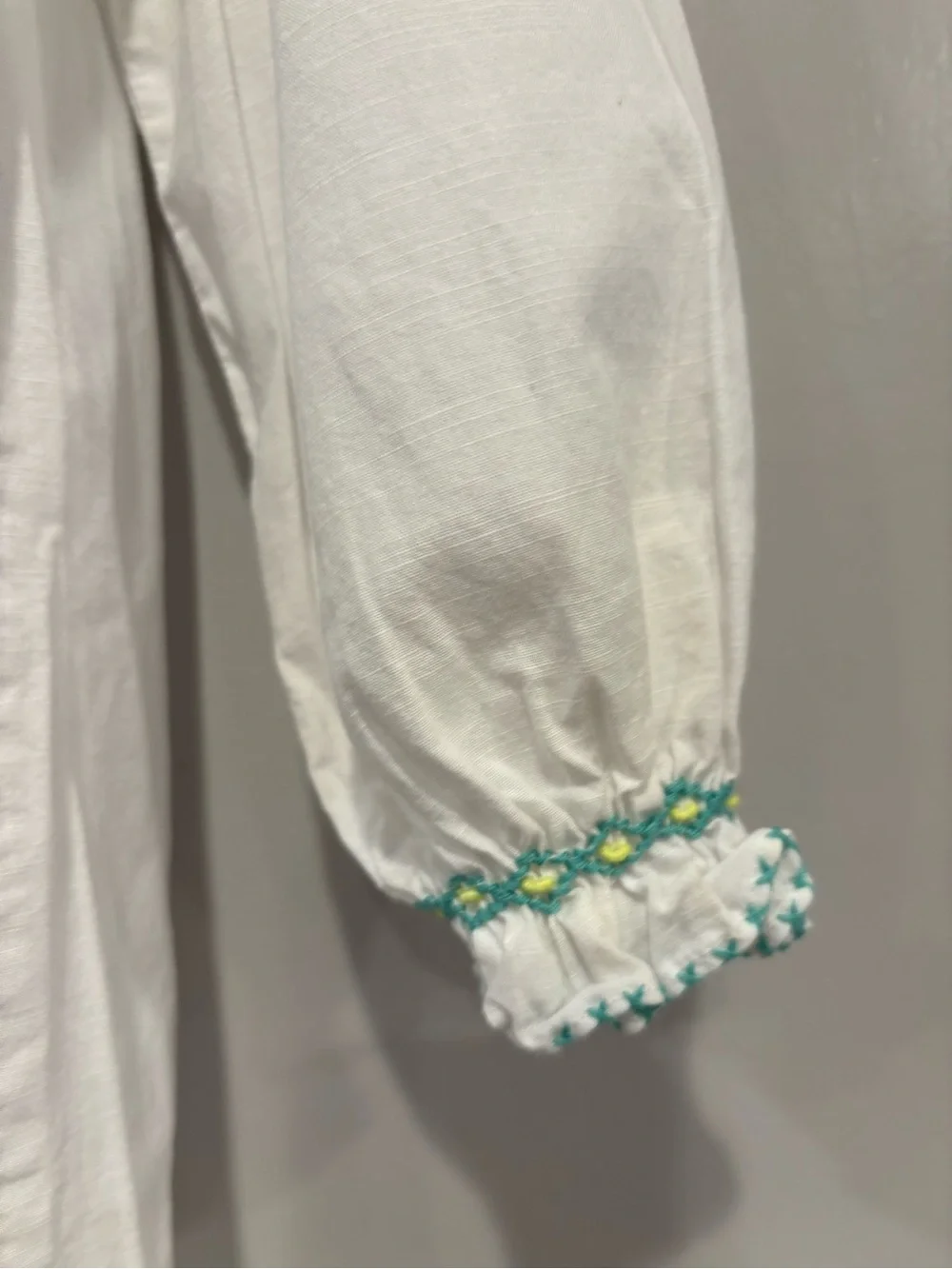 White Girls' Long Sleeve Dress with Mint Smocking Detail Hand Smocked.